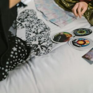 A mystical scene showing an intimate tarot card reading, exploring spiritual energy.